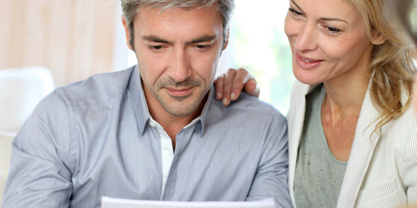 couple reading the results of their new home survey